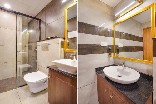 a bathroom with a sink and a toilet and a mirror at Oriva Freshco in Bengaluru