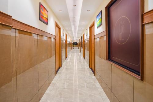 a hallway of a building with a long corridor at Oriva Freshco in Bengaluru