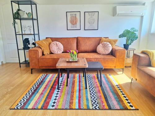 a living room with a couch and a coffee table at Blue Promenade Apartments in Dubrovnik