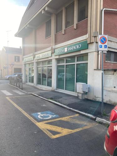 an empty parking lot in front of a music store at Misani Apartments in Novara