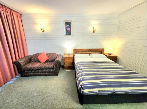 Ένα ή περισσότερα κρεβάτια σε δωμάτιο στο Finley Motel