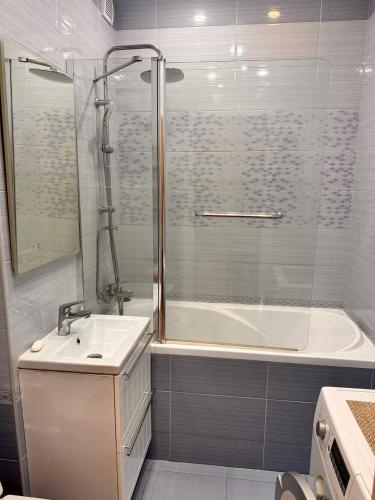 a bathroom with a tub and a sink and a shower at casa unica con vista sulla strada 12 in Caiazzo