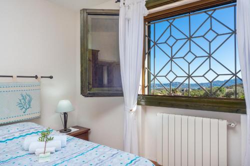 Posteľ alebo postele v izbe v ubytovaní Sun House Appartamento Vista Mare