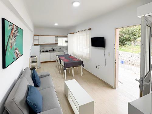 a living room with a couch and a table at Filio's home in Zárakes