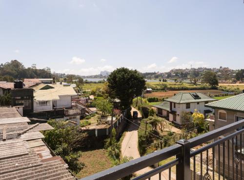 a view of a small town from a balcony at Hotel Grand Turf By GSP in Nuwara Eliya