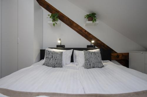 Ένα ή περισσότερα κρεβάτια σε δωμάτιο στο Spirit Apartman