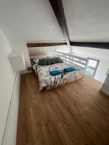 a bedroom with a bed in the middle of a room at Lovely studio perfect for couples close to beach in Moliets-et-Maa