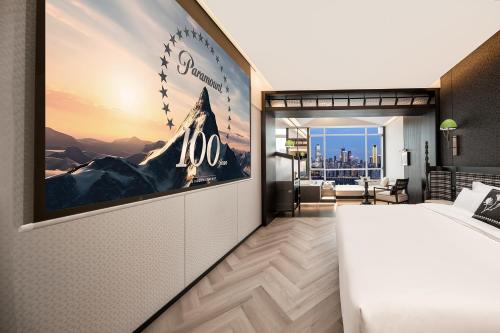 a hotel room with a large poster on the wall at 重庆Indition英迪逊酒店江北嘴金融城店 in Chongqing