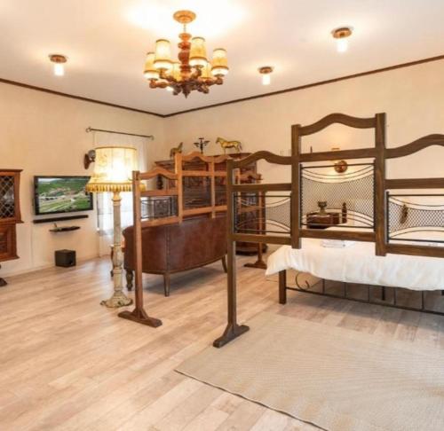 a bedroom with two bunk beds and a chandelier at Frumuseţe in Veliko Tŭrnovo
