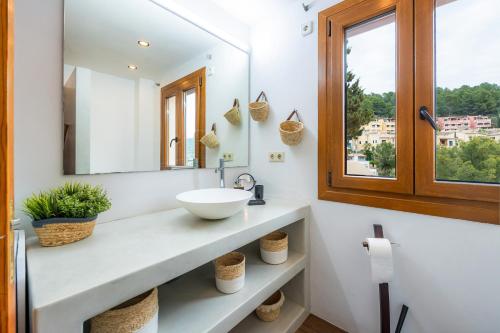 a bathroom with a sink and a mirror at Villa Carla in Port de Soller