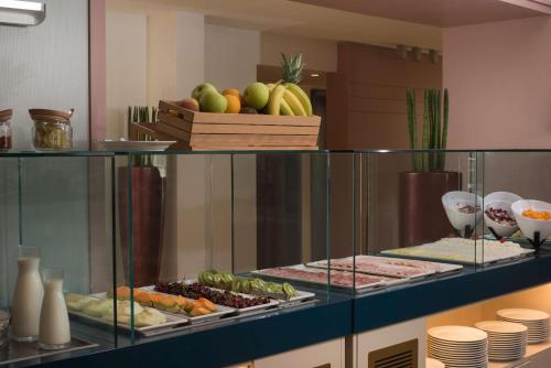 a display case with different types of food on at NH Palermo in Palermo