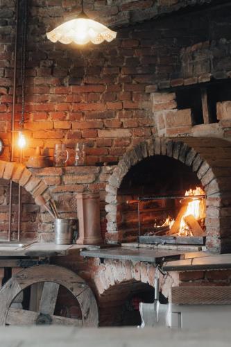a brick oven with a fire in it at Südburgenland Vierkanthof in Doiber