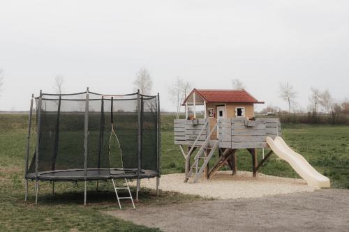 a playground with a slide and a play structure at Südburgenland Vierkanthof in Doiber