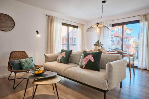 a living room with a couch and a table at Apartment in the heart of Javea - By Welcomely in Jávea
