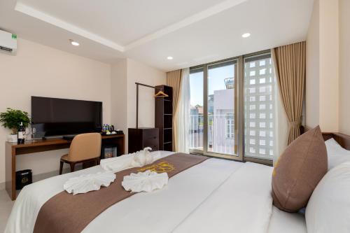 Ένα ή περισσότερα κρεβάτια σε δωμάτιο στο Yen Luxury Hotel