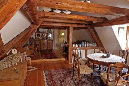 a dining room with a table and chairs in a room at Hotel und Gasthof Ritter St. Georg in Erlangen