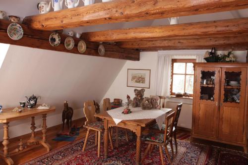 a dining room with a wooden table and chairs at Hotel und Gasthof Ritter St. Georg in Erlangen
