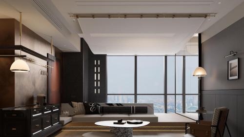 a living room with a couch and a table at 重庆Indition英迪逊酒店江北嘴金融城店 in Chongqing