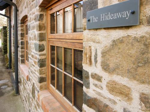 a sign on the side of a building at The Hideaway in Bishops Castle