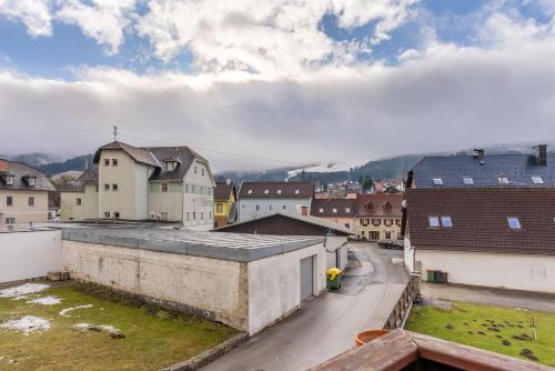 a view of a town with houses and a street at RosHof Apartments in Spital am Semmering