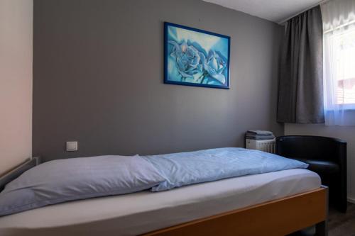Katil atau katil-katil dalam bilik di Hotel Adler Kornwestheim