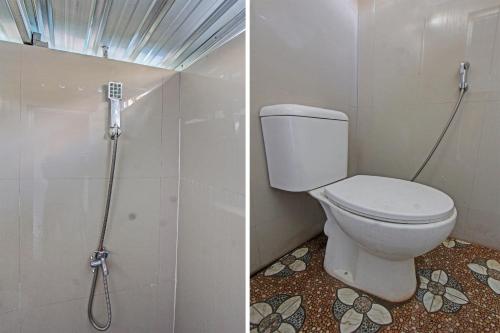 a bathroom with a toilet and a shower at Hotel O J3 in Labuan Lombok