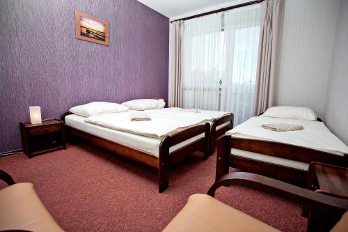 Letto o letti in una camera di Villa Centrum Młodości