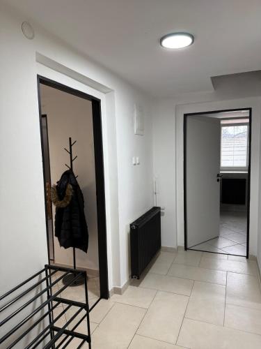 a room with a mirror on the wall next to a door at Levné a dostupné ubytovaní in Teplice
