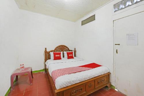 Postel nebo postele na pokoji v ubytování Hotel O Arimbi