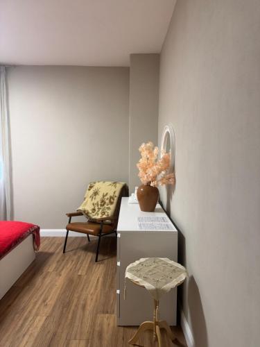 a room with a bed and a table and a chair at Modern & Cosy Flat in Maniago! in Maniago