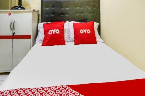 Ένα ή περισσότερα κρεβάτια σε δωμάτιο στο OYO Life 91335 Micheline Family 2 Syariah