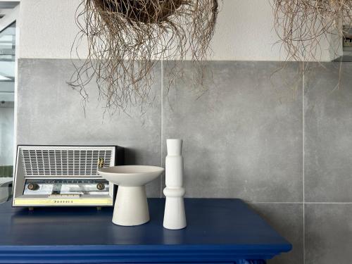 a table with a sink and a radio on it at 87029house in Scalea