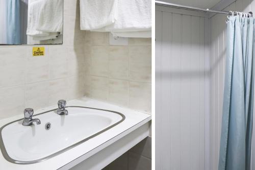 a bathroom with a sink and a shower at Hotel 346 in Manchester