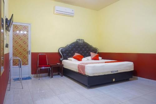 Кровать или кровати в номере Hotel O Sari Jeneponto