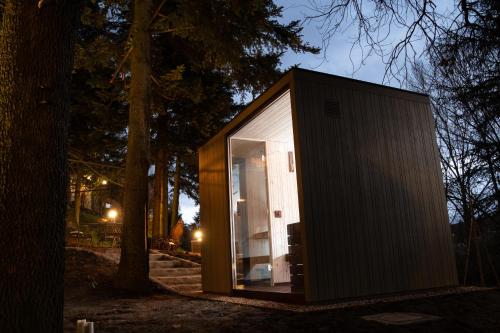 a small house in the woods at night at Villa Messori Spa in Castelvetro di Modena