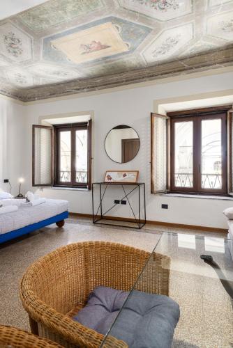a living room with a coffered ceiling and a couch at UNYCA - La Loggia Suite in Florence