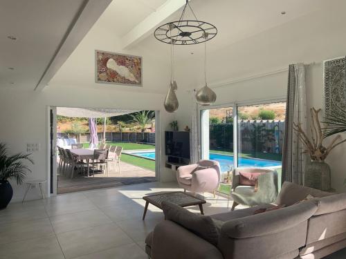 Photo de la galerie de l'établissement Villa 12 personnes piscine chauffée et jacuzzi, à Capbreton