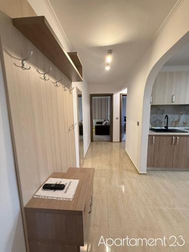 a large kitchen with a table in a room at Apartamente Felix in Baile Felix