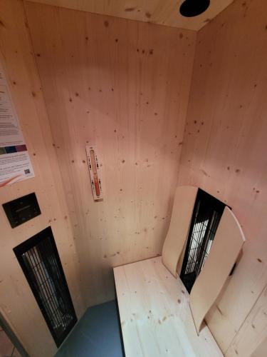 an inside view of a room with a chair in it at Komfort Appartement Royal Windberger in Schladming