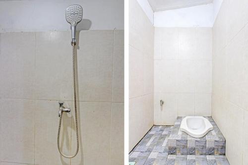 a shower and a toilet in a bathroom at SPOT ON 91521 Mayong Guesthouse in Jepara