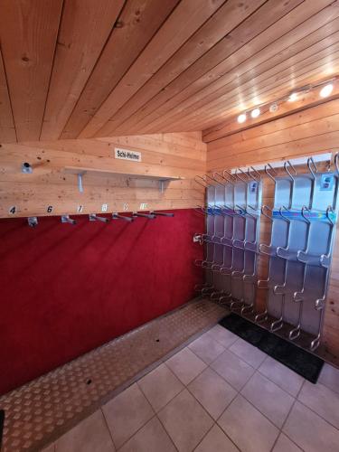 a locker room with wooden walls and lockers at Komfort Appartement Royal Windberger in Schladming