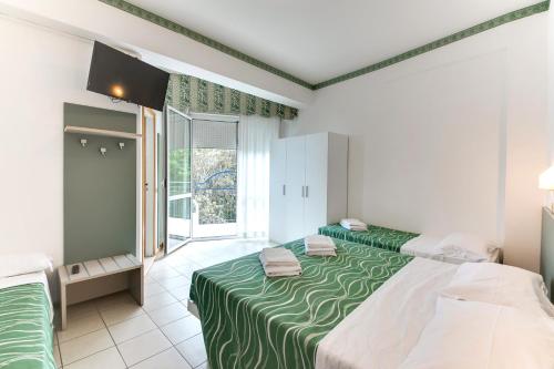 Postel nebo postele na pokoji v ubytování Hotel Internazionale