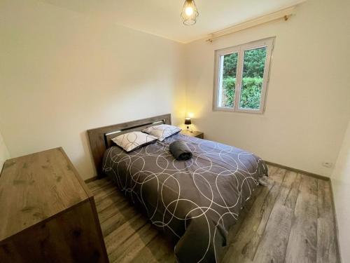 a bedroom with a bed and a window at Gîte de plain-pied en Touraine avec grand jardin et parking - FR-1-381-613 in Courcelles-de-Touraine