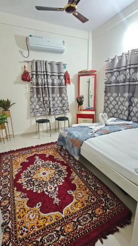 a bedroom with a bed and a rug on the floor at Chandrajyoti Villa 5 Ground floor Villa in Nagpur