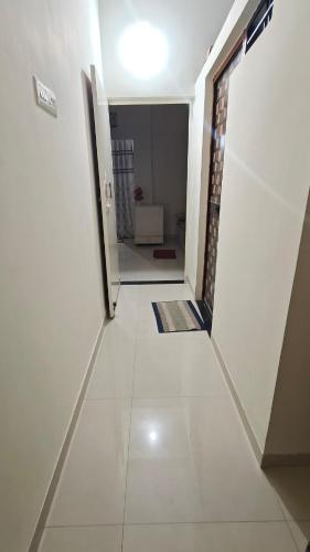 an empty hallway with a door to a room at Chandrajyoti Villa 5 Ground floor Villa in Nagpur