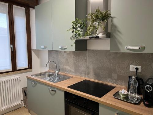 a kitchen with a sink and a counter top at Pit Stop In Maranello in Maranello