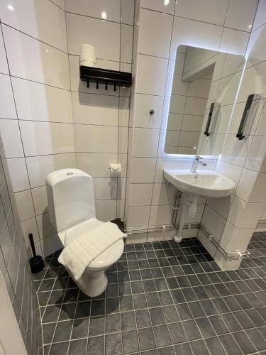 Ванная комната в Unique Hotel