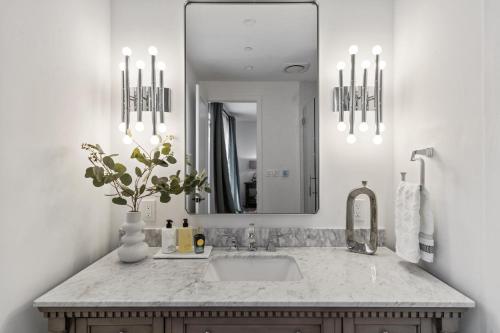 a bathroom with a sink and a mirror at Ocean Whispers home in Moss Beach