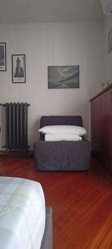 a bedroom with two beds and a radiator at Casa Vanessa Appartamento in Villa in Pieve Emanuele