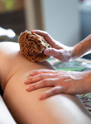 a woman holding a piece of bread on her stomach at Bes Hotel Terme a Palazzago in Palazzago